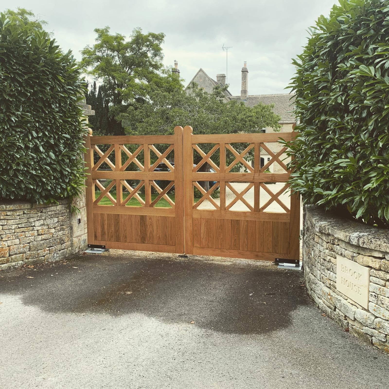 underground wooden swing gates — installation by Complete Gate Automation