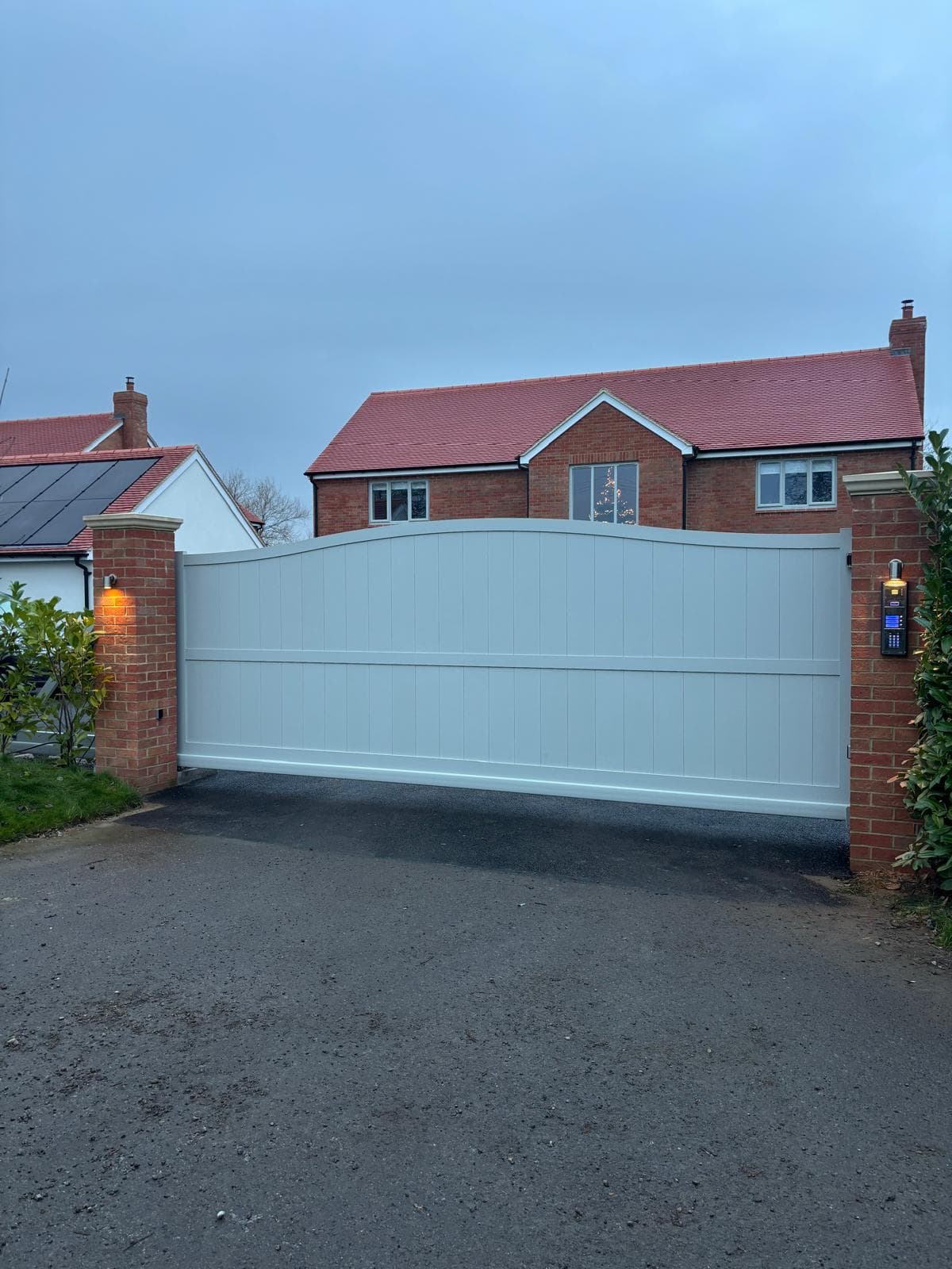 white automatic swing gates — installation by Complete Gate Automation